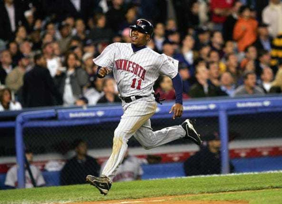 Outfielder Jacque Jones #11 of the Minnesota Twins bats during Game 2 of the American League Division Series with the New York Yankees on October 6, 2004 at Yankee Stadium in the Bronx borough of New York City. The Yankees won 7-6.