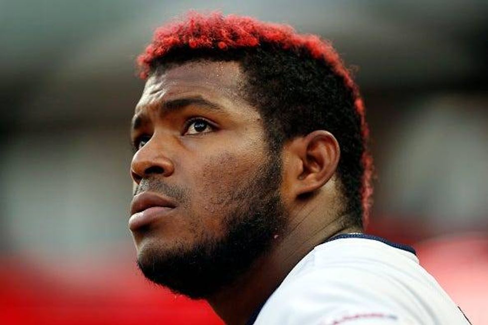 Outfielder Yasiel Puig looks on from the Indians