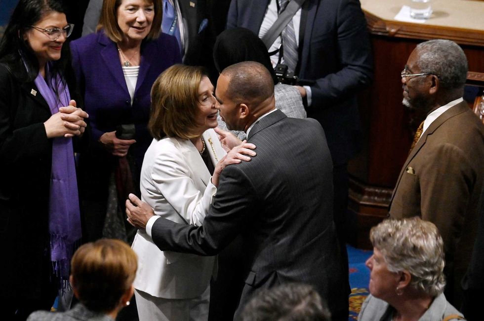 Outgoing House Speaker Nancy Pelosi, of California, greets Rep. Hakeem Jeffries, of New York, after speaking in the House Chamber at the U.S. Capitol in Washington, DC, on Nov. 17, 2022
