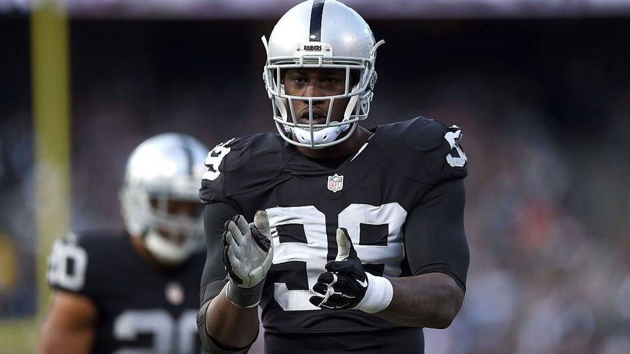 Outside linebacker Aldon Smith #99 of the Oakland Raiders celebrates in the third quarter against the Minnesota Vikings at O.co Coliseum on November 15, 2015 in Oakland, California.
