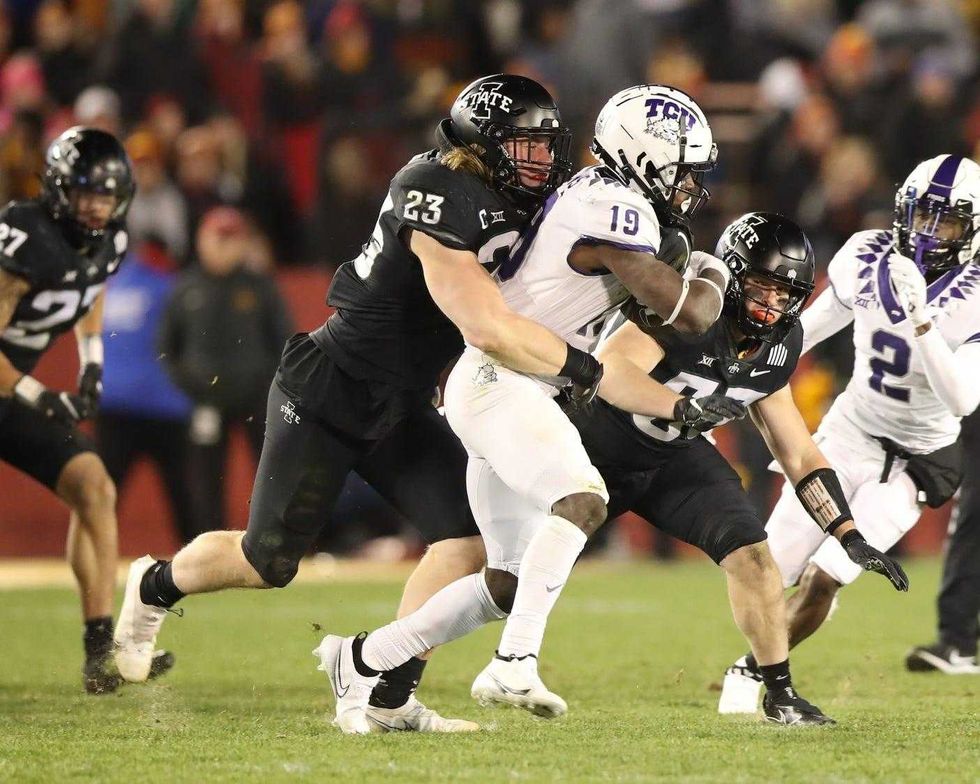 owa State Cyclones linebacker Mike Rose (23) tackles TCU Horned Frogs wide receiver TJ Steele (19) at Jack Trice Stadium.