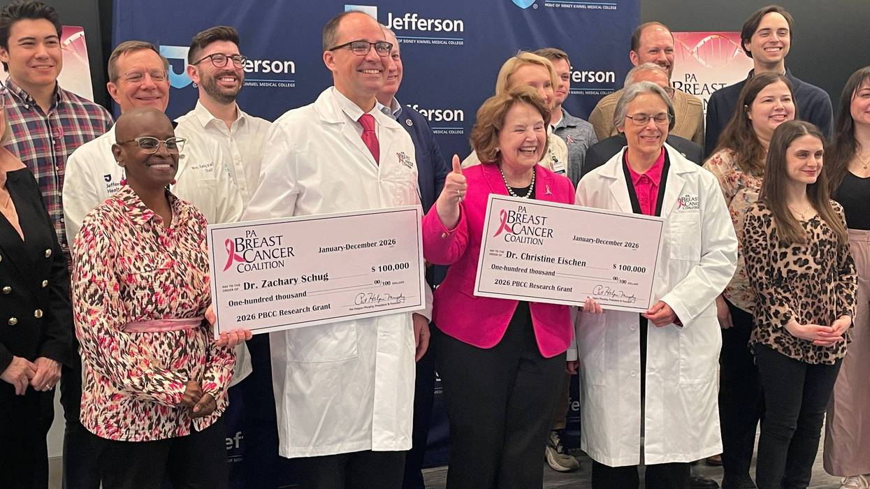 PA Breast Cancer Coalition President Pat Halpin-Murphy (center) awards $100,000 grants to Dr. Zachary Shrug and Dr. Christine Eischen for their research into immunotherapy and triple-negative breast cancer.