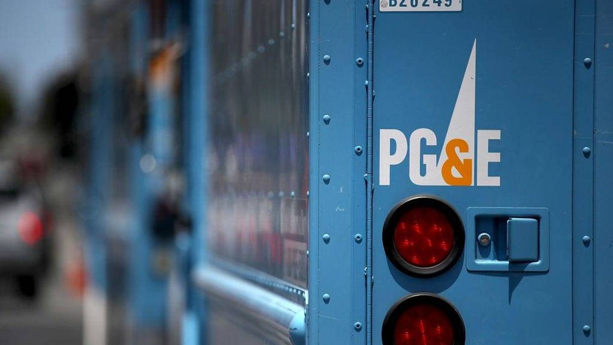 Pacific Gas and Electric (PG&E) trucks sit parked on a street on June 18, 2018 in San Francisco, California.