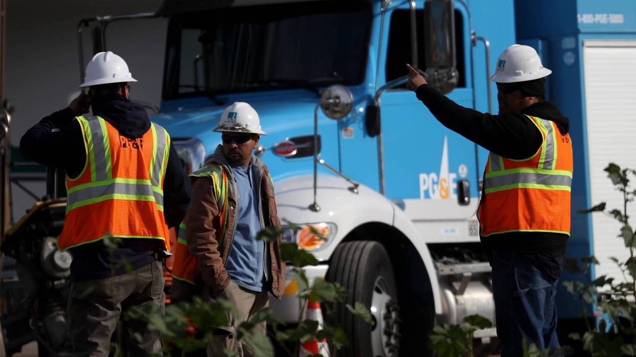 Pacific Gas and Electric (PG&E) workers remain at the scene of a three-alarm fire that started after a construction crew hit a gas line on February 07, 2019 in San Francisco, California.