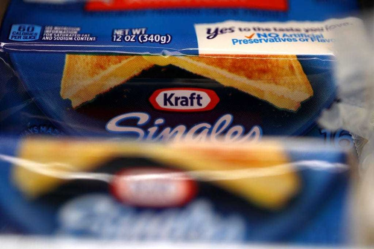 Packages of Kraft Singles are displayed on a grocery store shelf on February 22, 2019 in San Rafael, California.
