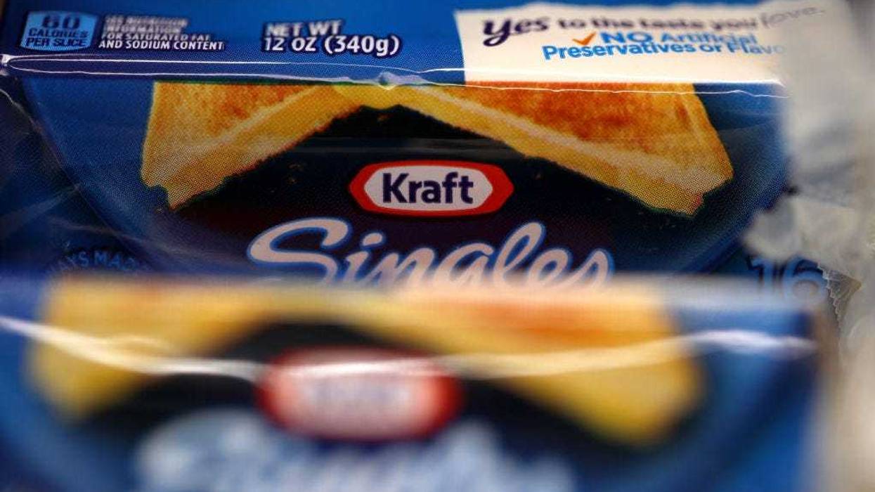 Packages of Kraft Singles are displayed on a grocery store shelf on February 22, 2019 in San Rafael, California.