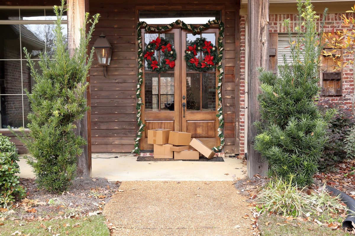 Packages on porch with Christmas decorations
