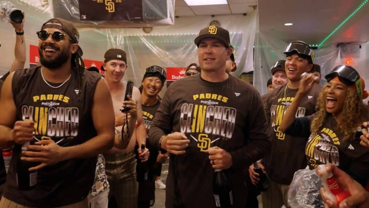 Padres Manager Craig Stammen prepares to address the team before their locker room celebration at Uniqlo Field in Los Angeles after clinching a playoff appearance