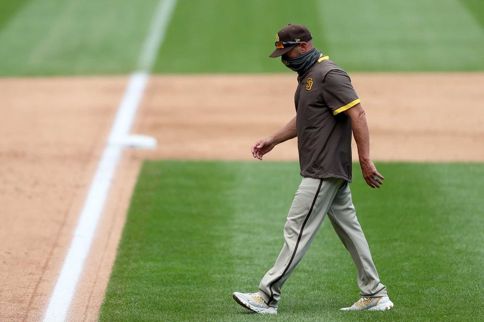 Padres manager Jayce Tingler returns to the dugout after a mound visit