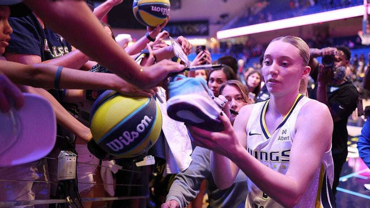 Paige Bueckers #5 of the Dallas Wings signs autographs after the preseason game against the Toyota Antelopes at College Park Center on May 10, 2025 in Arlington, Texas.