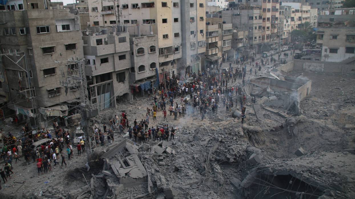 Palestinian citizens inspect damage from Israeli air strikes