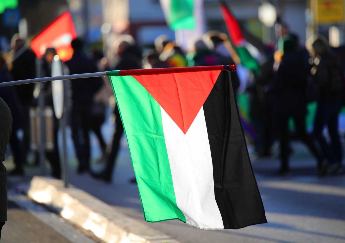 Palestinian flag flying.