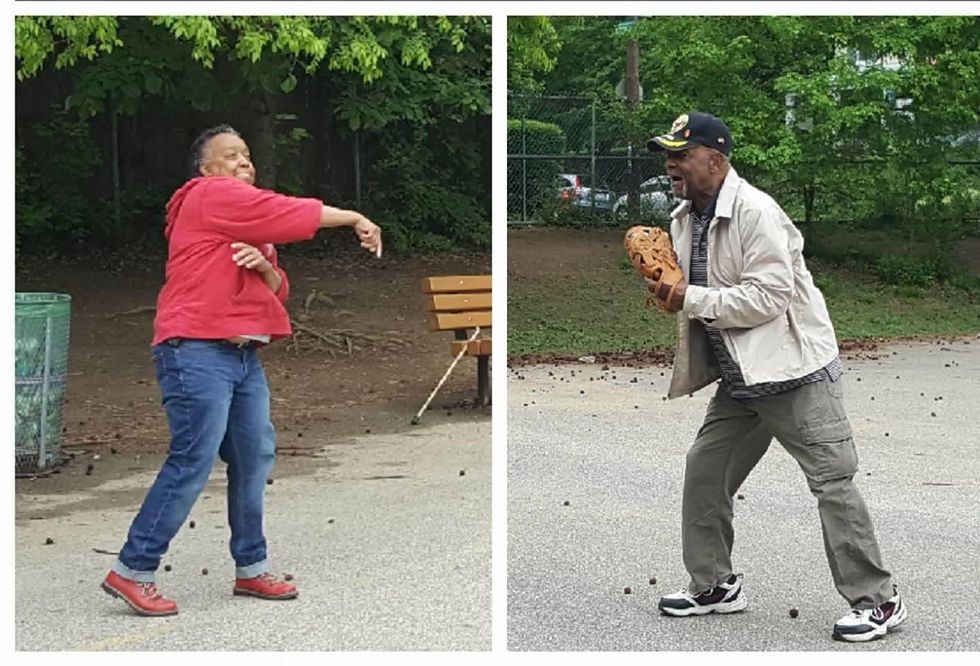 Pam Hall practicing for her ceremonial first pitch with her father.