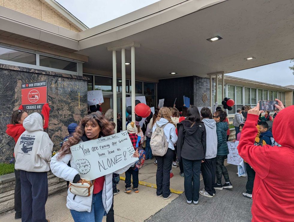 Parents and students protest abrupt closure of Catholic school
