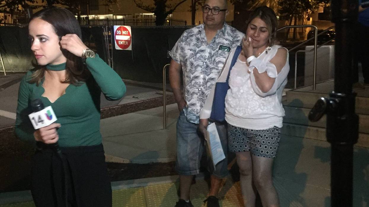 Parents wait outside of the emergency room at the Santa Clara Valley Medical Center where their 12-year-old daughter was being treated for a wound sustained at the Gilroy Garlic Festival shooting on July 28, 2019.