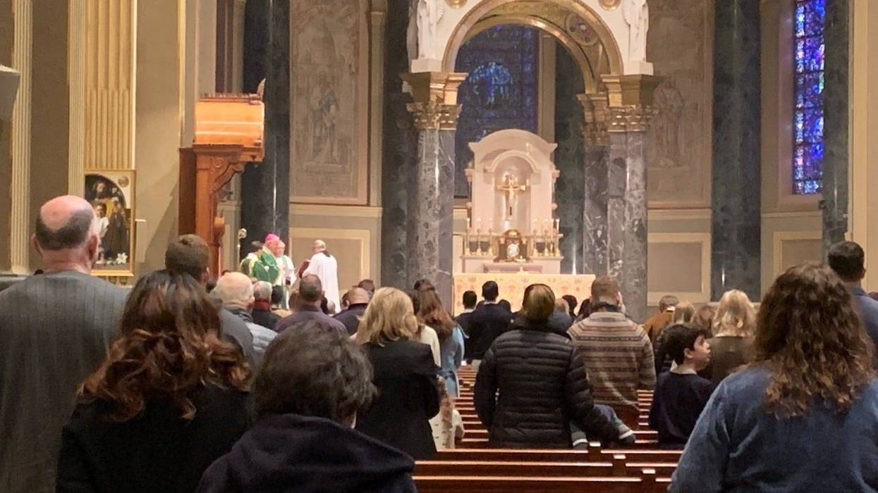 Parishioners pray for peace at a Mass for Ukraine Sunday morning at the Cathedral Basilica of Saints Peter and Paul in Center City.