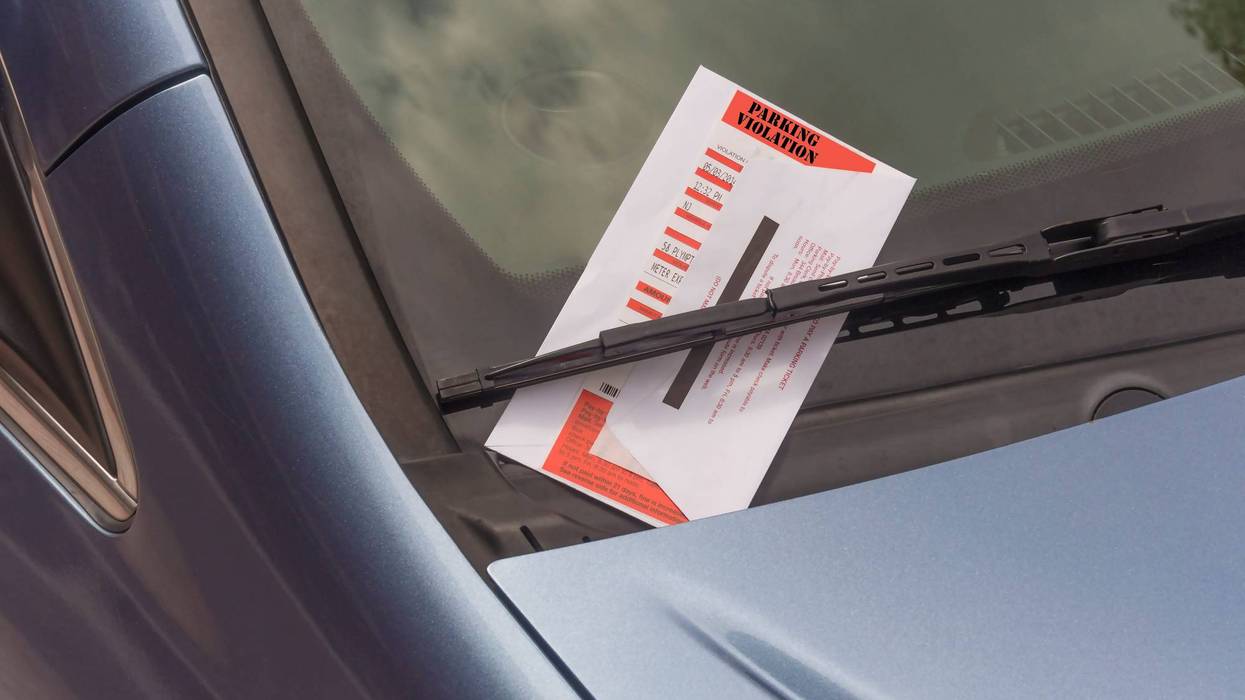 parking ticket violation on motor car windscreen or windshield.