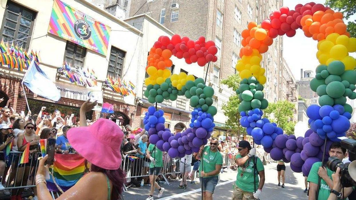 Part of the NYC Pride March moves past the Stonewall Inn in New York's Greenwich Village.