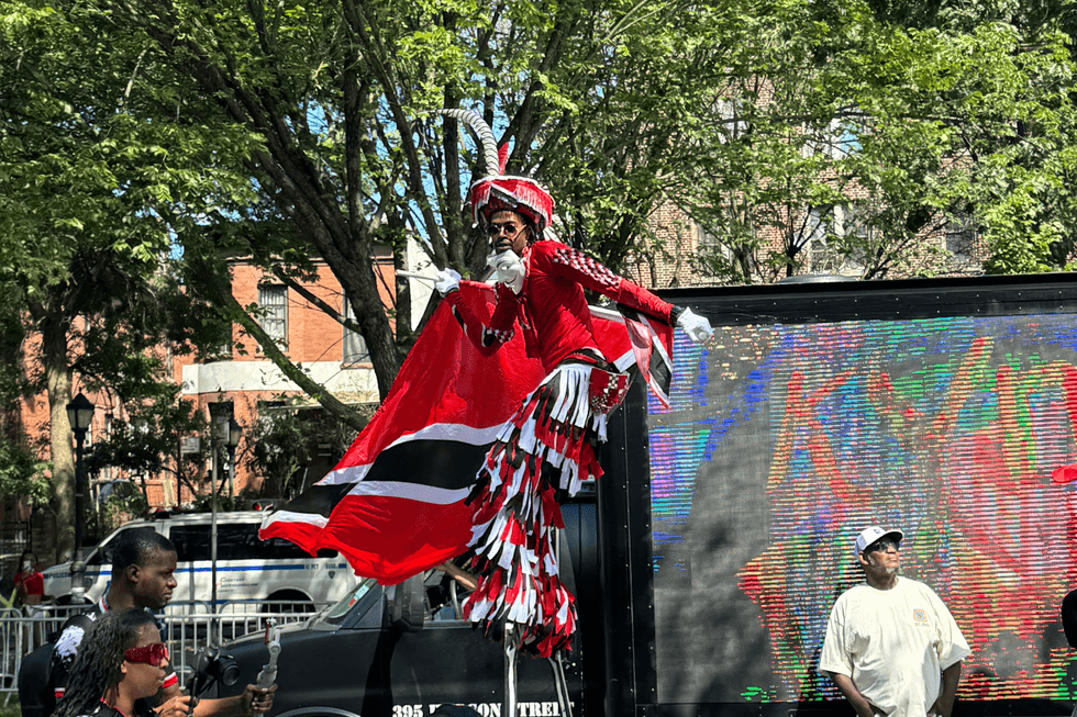 Participants in the West Indian American Day Parade march down Eastern Parkway in celebration of the Caribbean Carnival on September 02, 2024 in Brooklyn.