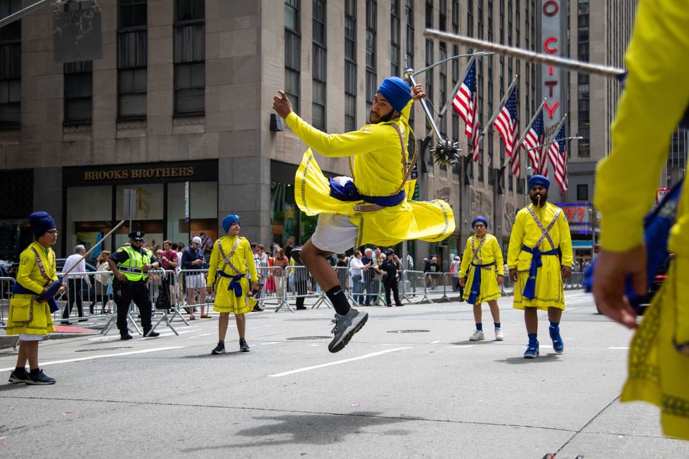 Participants perform during the first-ever annual Asian American and Pacific Islander AAPI Cultural and Heritage Parade in New York, the United States, May 15, 2022.