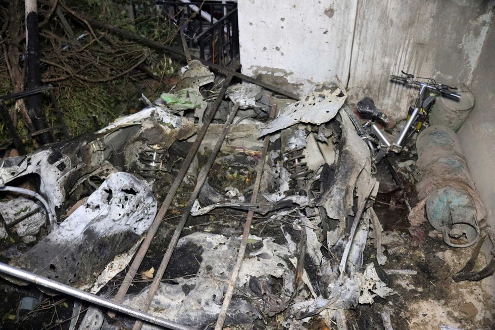 Parts of a destroyed vehicle is seen inside a house after U.S. drone strike in Kabul, Afghanistan, Sunday, Aug. 29, 2021. A U.S. drone strike destroyed a vehicle carrying "multiple suicide bombers" from Afghanistan