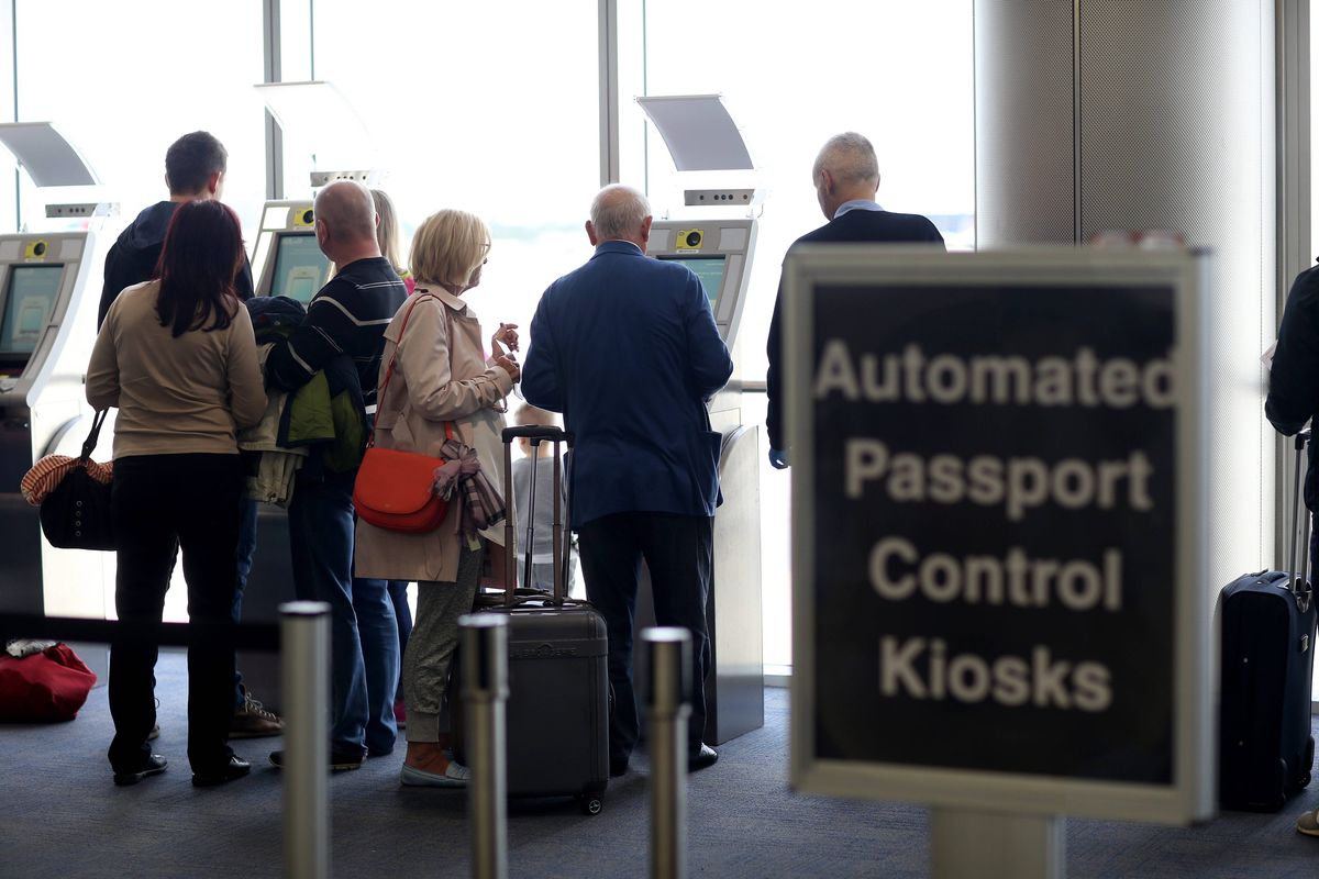 Passengers use the Automated Passport Control Kiosks in Miami.