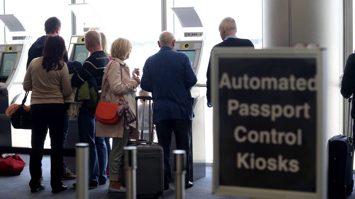 Passengers use the Automated Passport Control Kiosks in Miami.