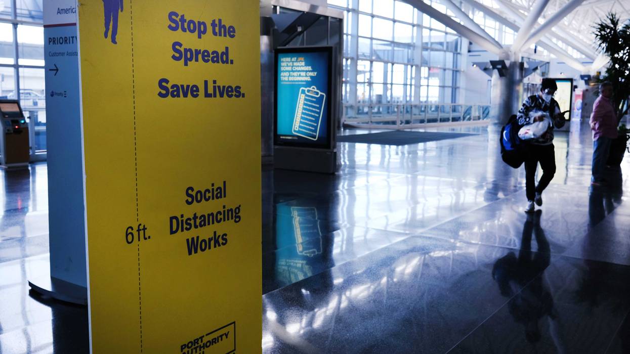 Passengers walk through a near empty John F. Kennedy Airport (JFK) due to the ongoing cutbacks in travel because of the coronavirus on April 16, 2020 in New York City.