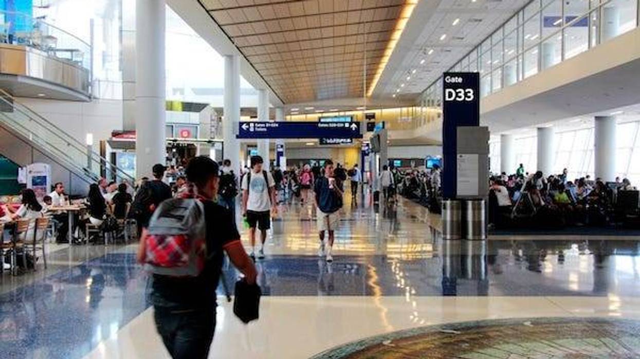 Passengers walking inside a terminal at DFW Airport