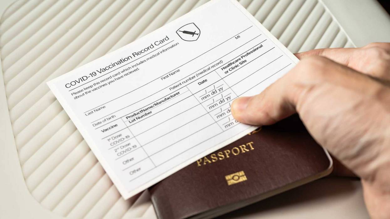 Passport and vaccine card stock photo.