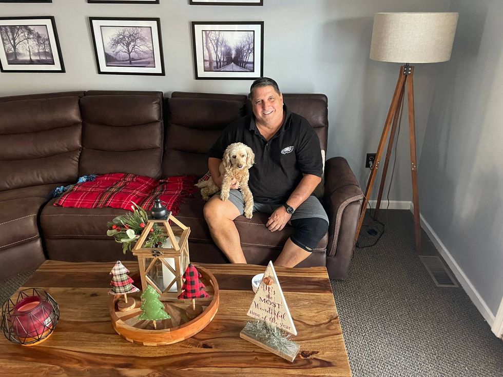 Pat DiCrecchio is shown in his family room, which was turned into a "laundry room" for the commercial.