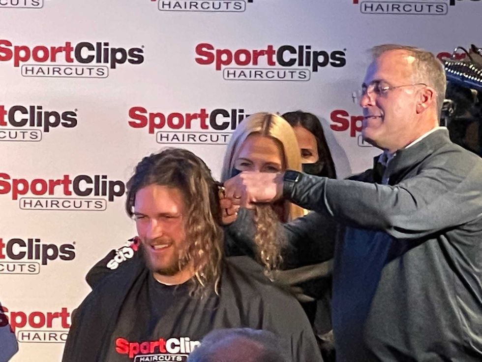 Pat Narduzzi cutting Adomitis hair