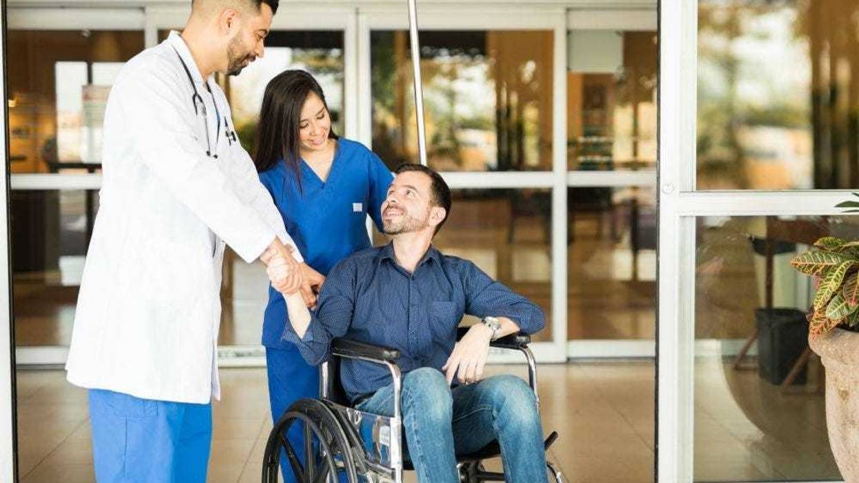 patient and doctors leaving hospital