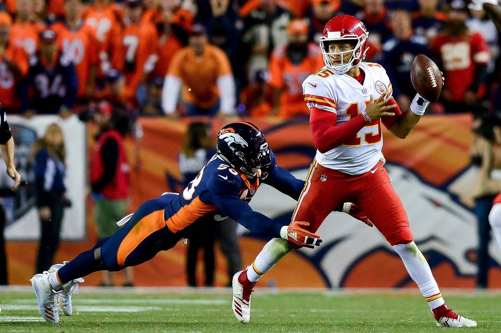Patrick Mahomes being chased by Broncos linebacker Von Miller