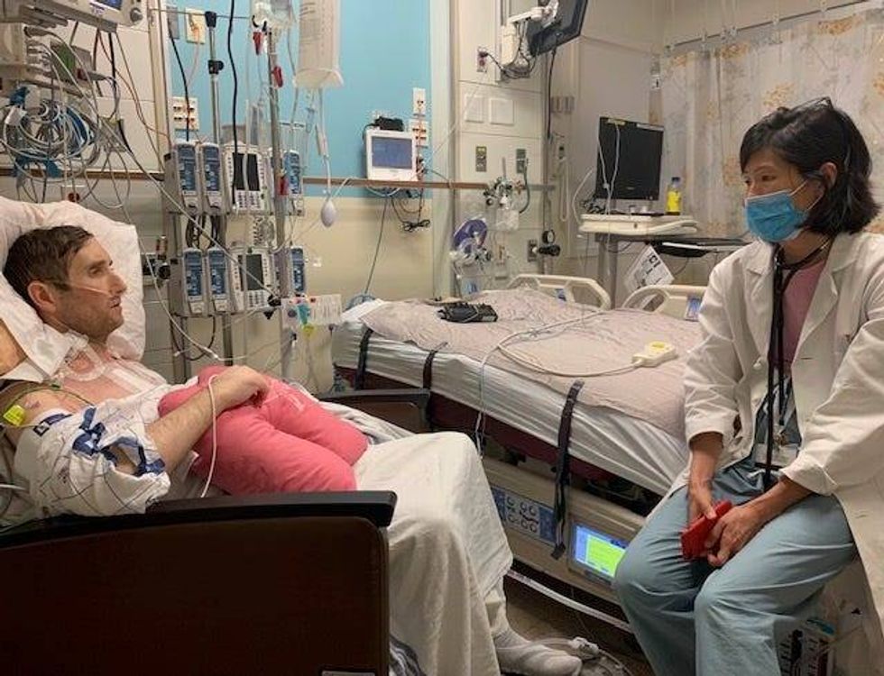 Patrick meets with his congenital heart doctor on the day after transplant surgery.