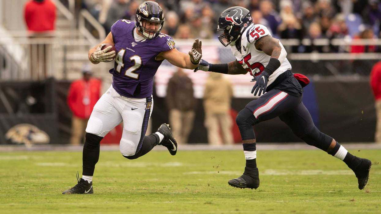 Patrick Ricard avoids a tackle in the Ravens win over Houston.