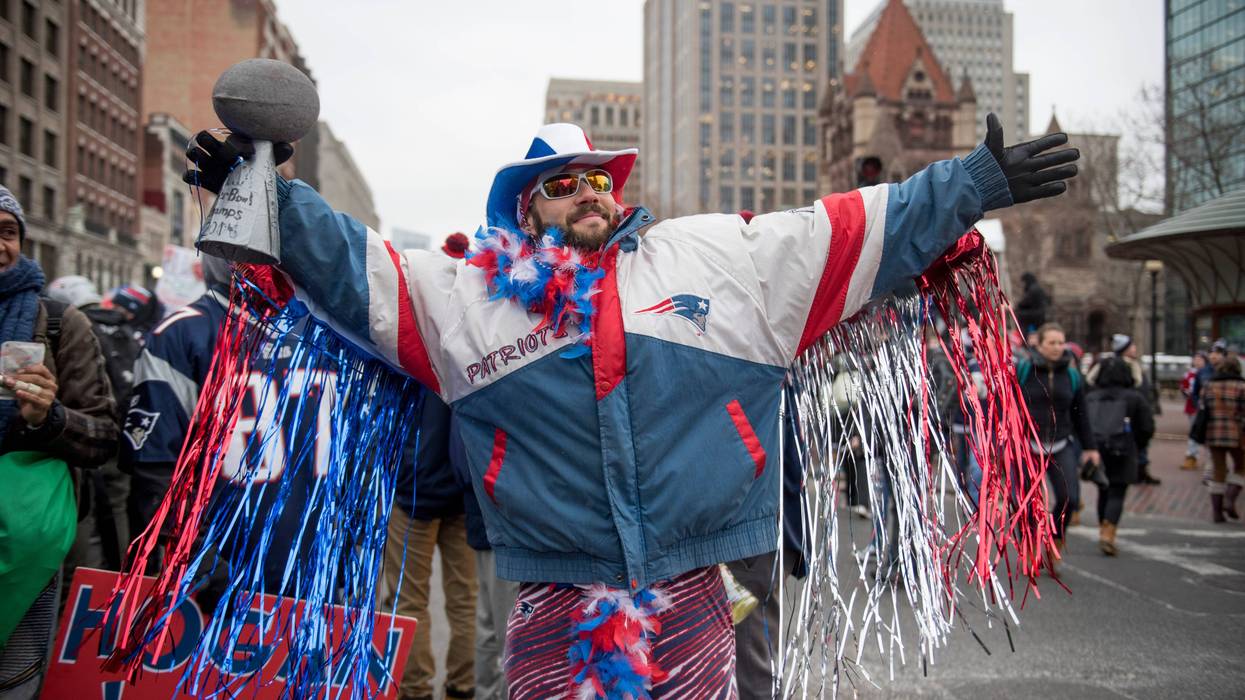 patriots fan celebrating in boston