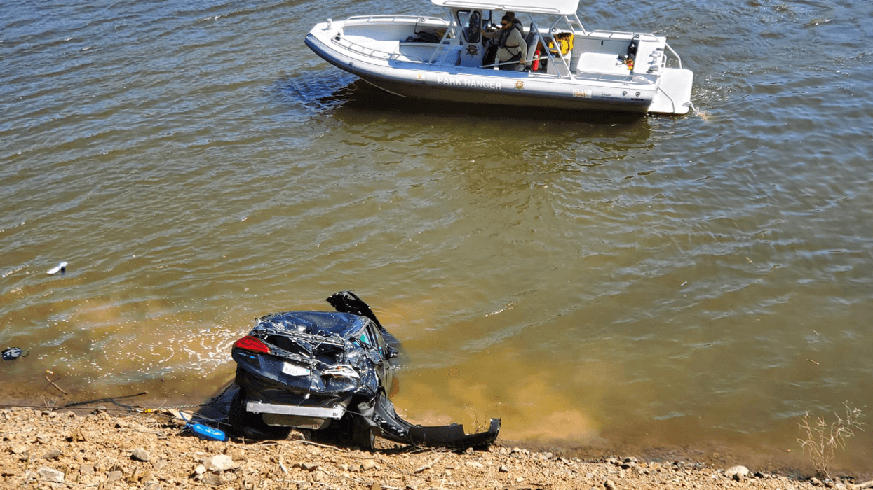 Patrol boat searches the water at the Uvas Reservoir in Morgan Hill on Tuesday.