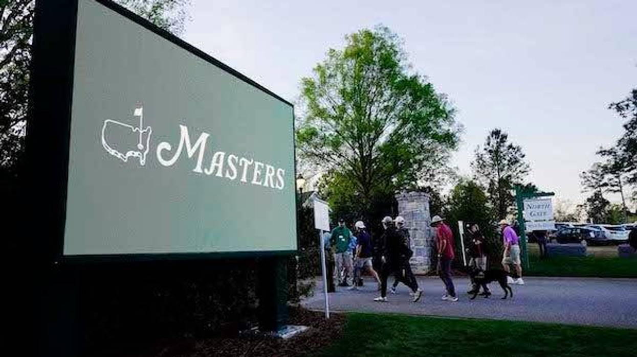Patrons make their way to the entrance before a practice round of The Masters golf tournament at Augusta National Golf Club