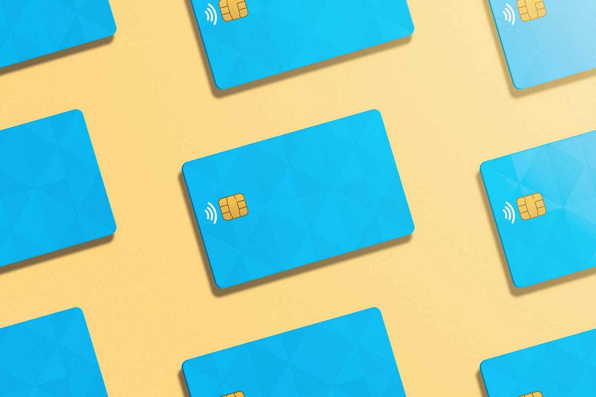 Pattern of realistic credit cards in light orange background.