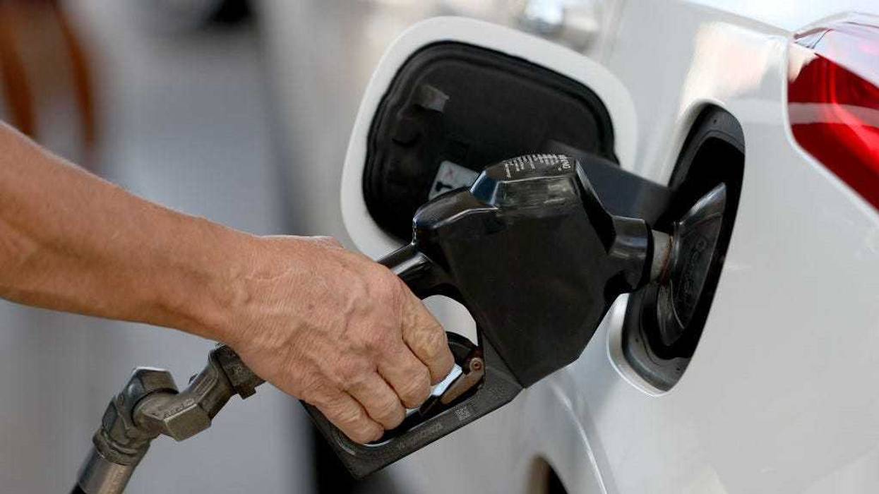 Paul Banaszak pumps gas into his vehicle at a Shell station on November 22, 2021 in Miami, Florida.