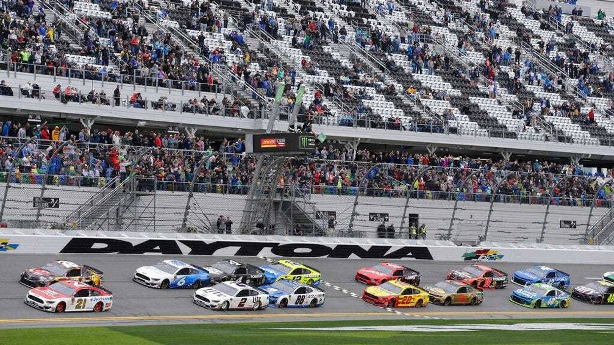 Paul Menard (21) and Kyle Busch, top left, lead the field of cars to start the NASCAR Clash auto race at Daytona International Speedway, Sunday, Feb. 10, 2019, in Daytona Beach, Fla.