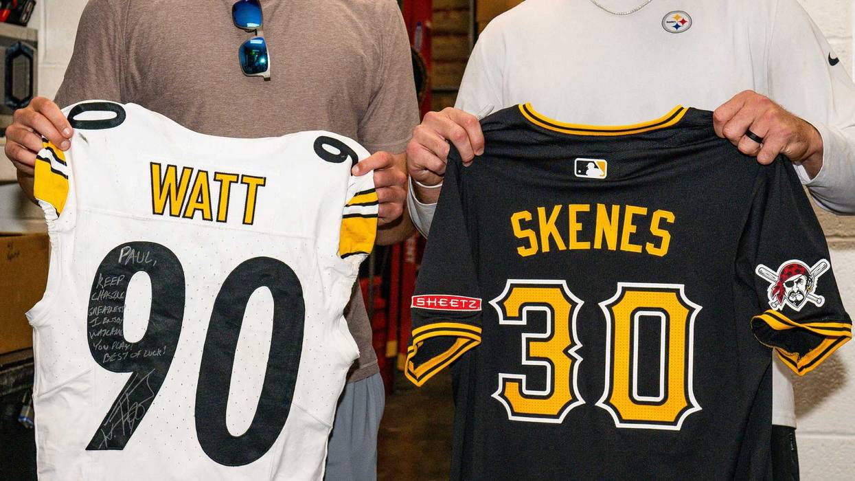 Paul Skenes and TJ Watt swapping jerseys at Steelers practice
