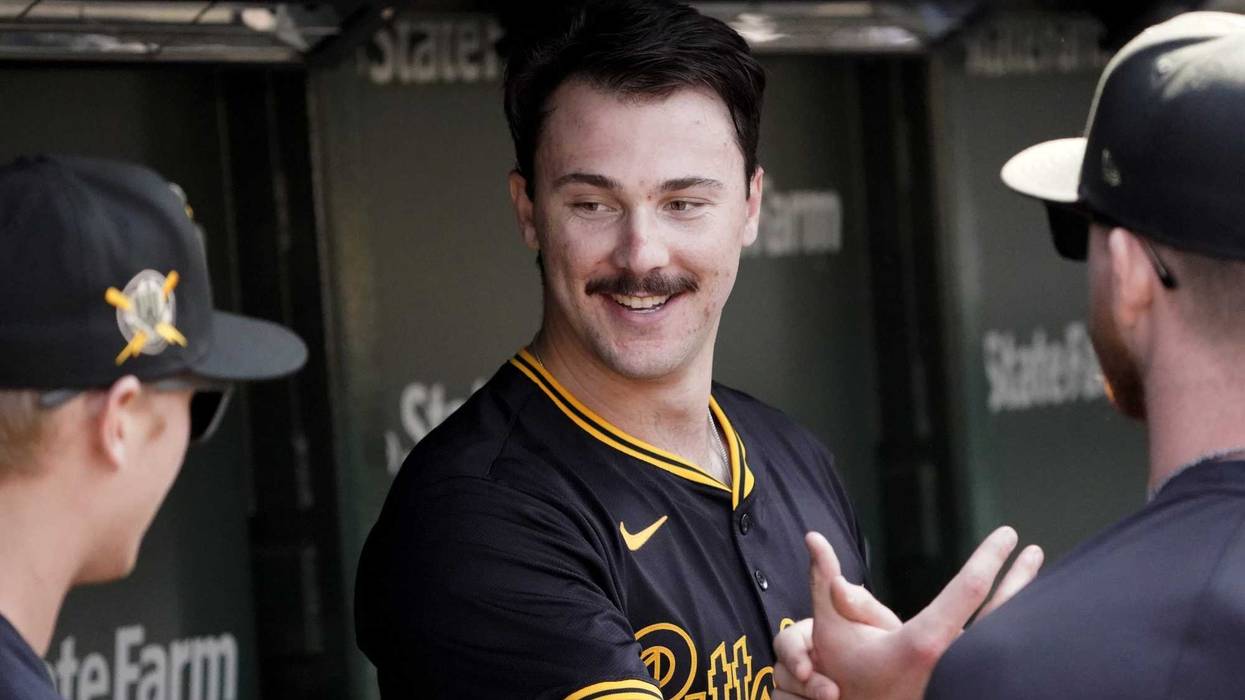 Paul Skenes getting congratulations in dugout