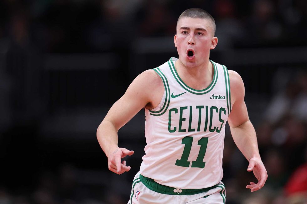 Payton Pritchard #11 of the Boston Celtics reacts after a made basket against the Chicago Bulls during the fourth quarter of the Emirates NBA Cup game at the United Center on November 29, 2024 in Chicago, Illinois.