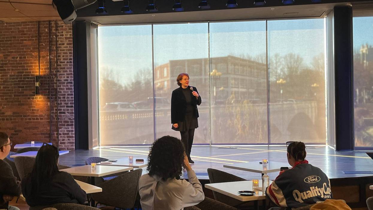 Peace Center CEO Megan Riegel speaks on the stage of the new "The Mockingbird on Main Street" venue
