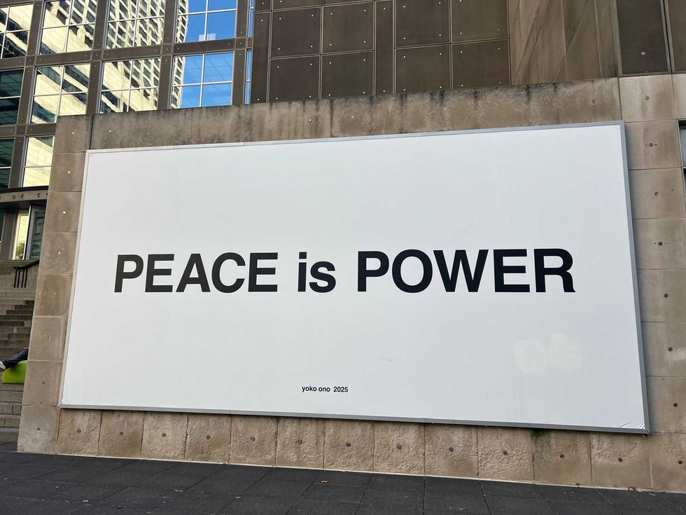 "Peace is Power" billboard on the MCA Plaza outside of the museum. "Yoko Ono: Music of the Mind" opens Oct. 18 at the MCA.