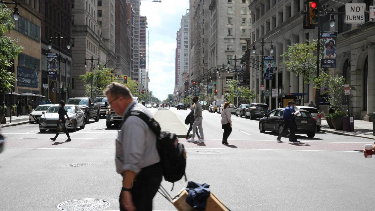 Pedestrians cross Broad Street in Center City.