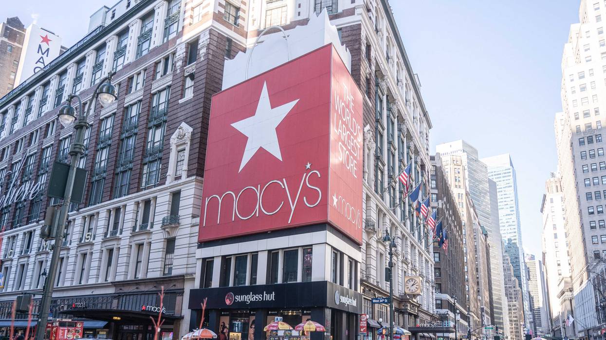 Pedestrians walk pass the Macy's Herald Square flagship store on 34th Street in Midtown Manhattan