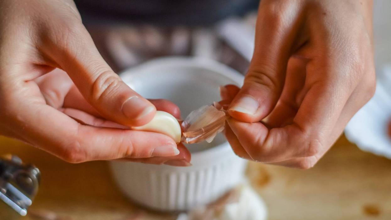 Peeling Garlic to make a cooking sauce